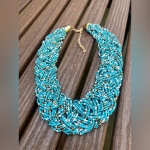 Turquoise multi-strand braided seed bead statement necklace.